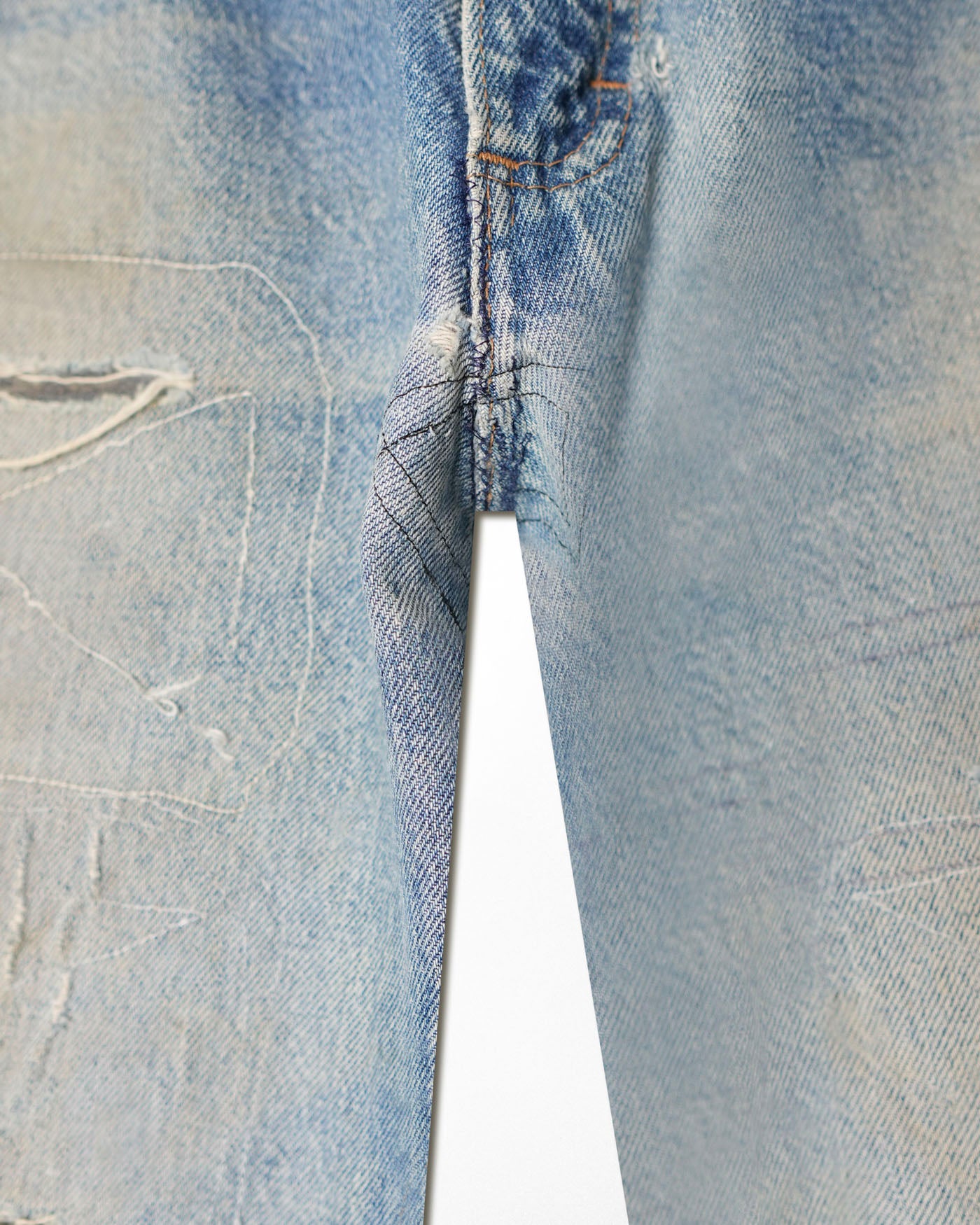 JOEBUCKS DISTRESSED AND REPAIRED LIGHT WASH JEANS