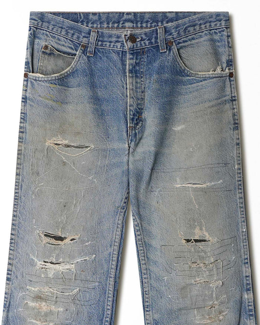 JOEBUCKS DISTRESSED AND REPAIRED LIGHT WASH JEANS