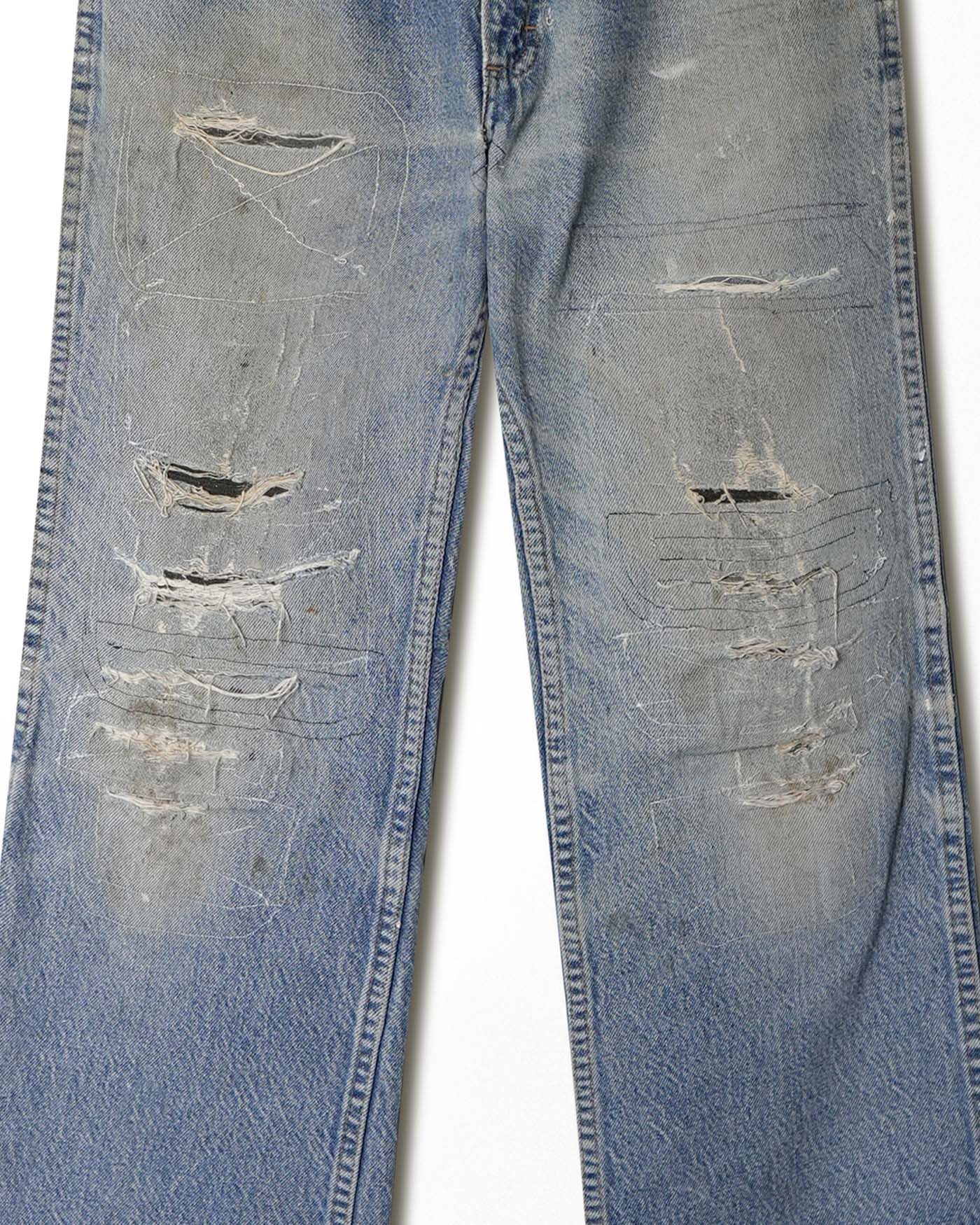 JOEBUCKS DISTRESSED AND REPAIRED LIGHT WASH JEANS