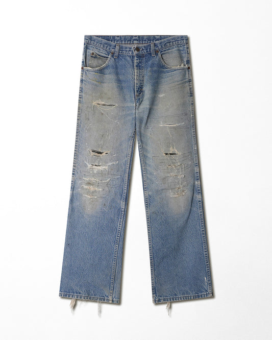 JOEBUCKS DISTRESSED AND REPAIRED LIGHT WASH JEANS