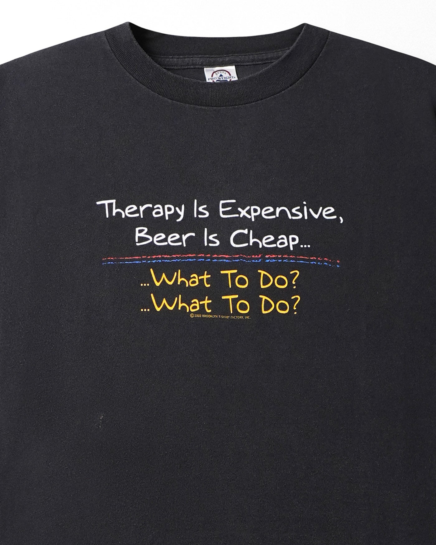 DELTA "THERAPY IS EXPENSIVE" BLACK T-SHIRT